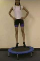 Photograph of patient doing a gentle jump on the mini trampoline.
