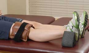 Using hanging weights to gain knee extension