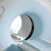 Photograph of an MRI coil, resembling a tube into which the patient is slid.